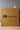 Brown box with GH2 Comfy Cloud branding on a gray wall background
